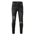 Men's black streetwear skinny jeans with striped angel print, distressed holes, high waist.